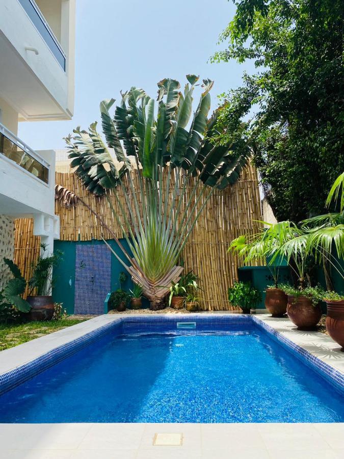 L'Oasis Guesthouse Котону Екстериор снимка