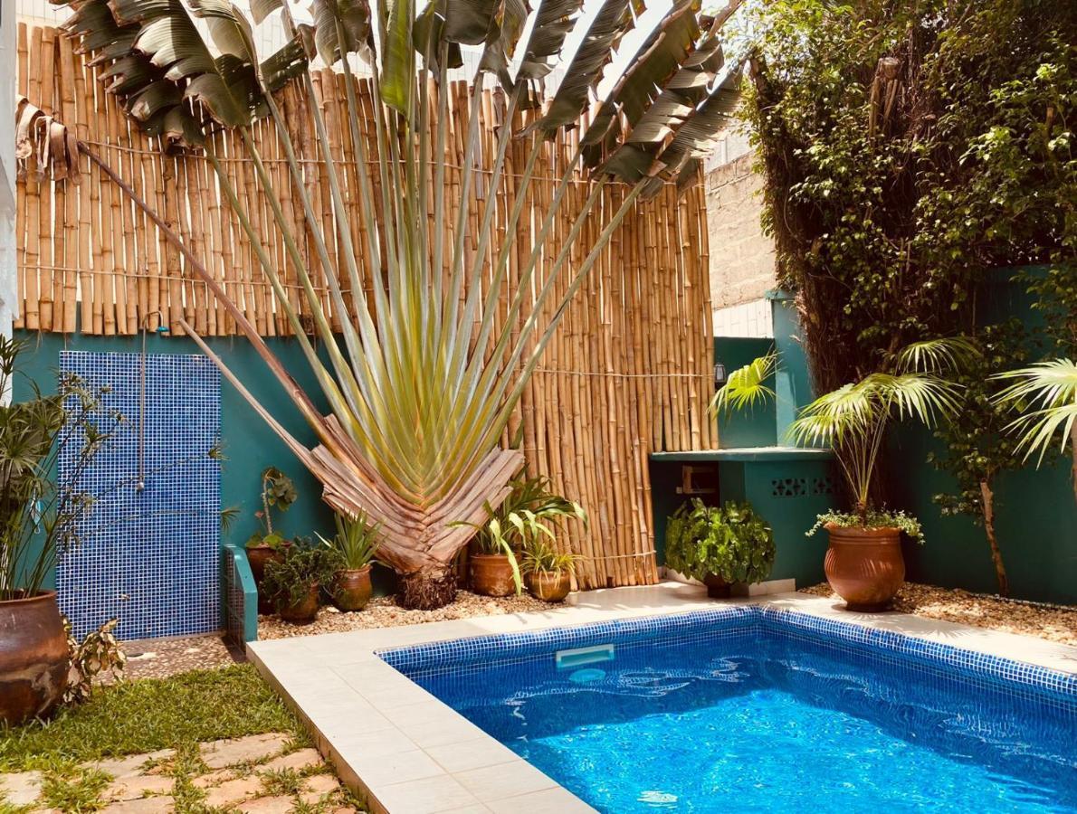 L'Oasis Guesthouse Котону Екстериор снимка