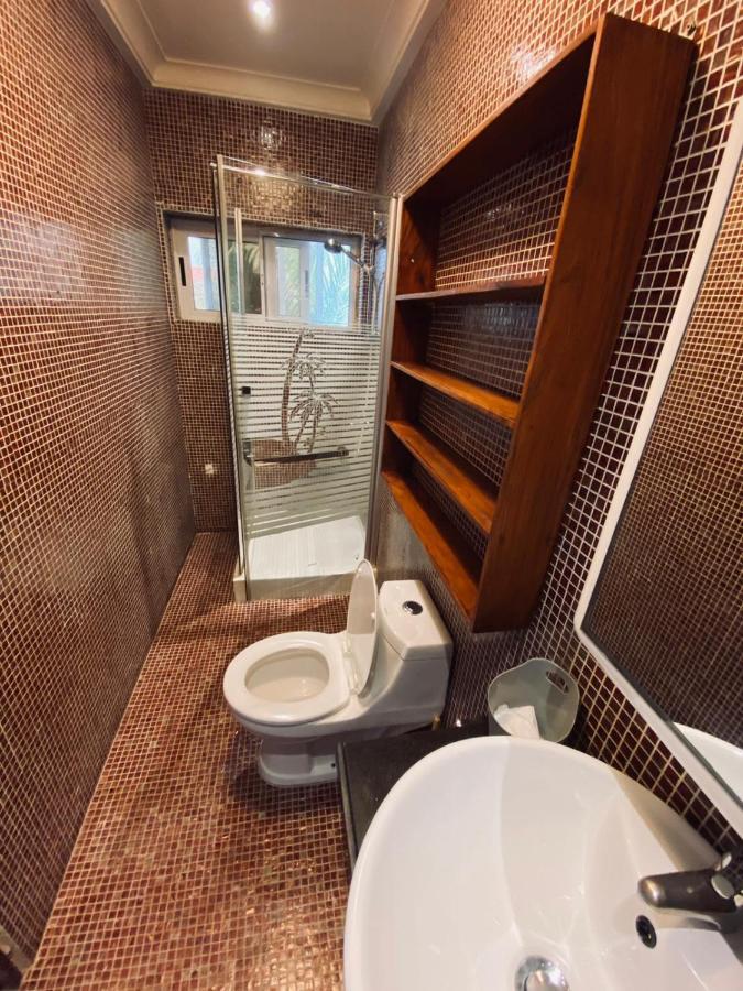 L'Oasis Guesthouse Котону Екстериор снимка
