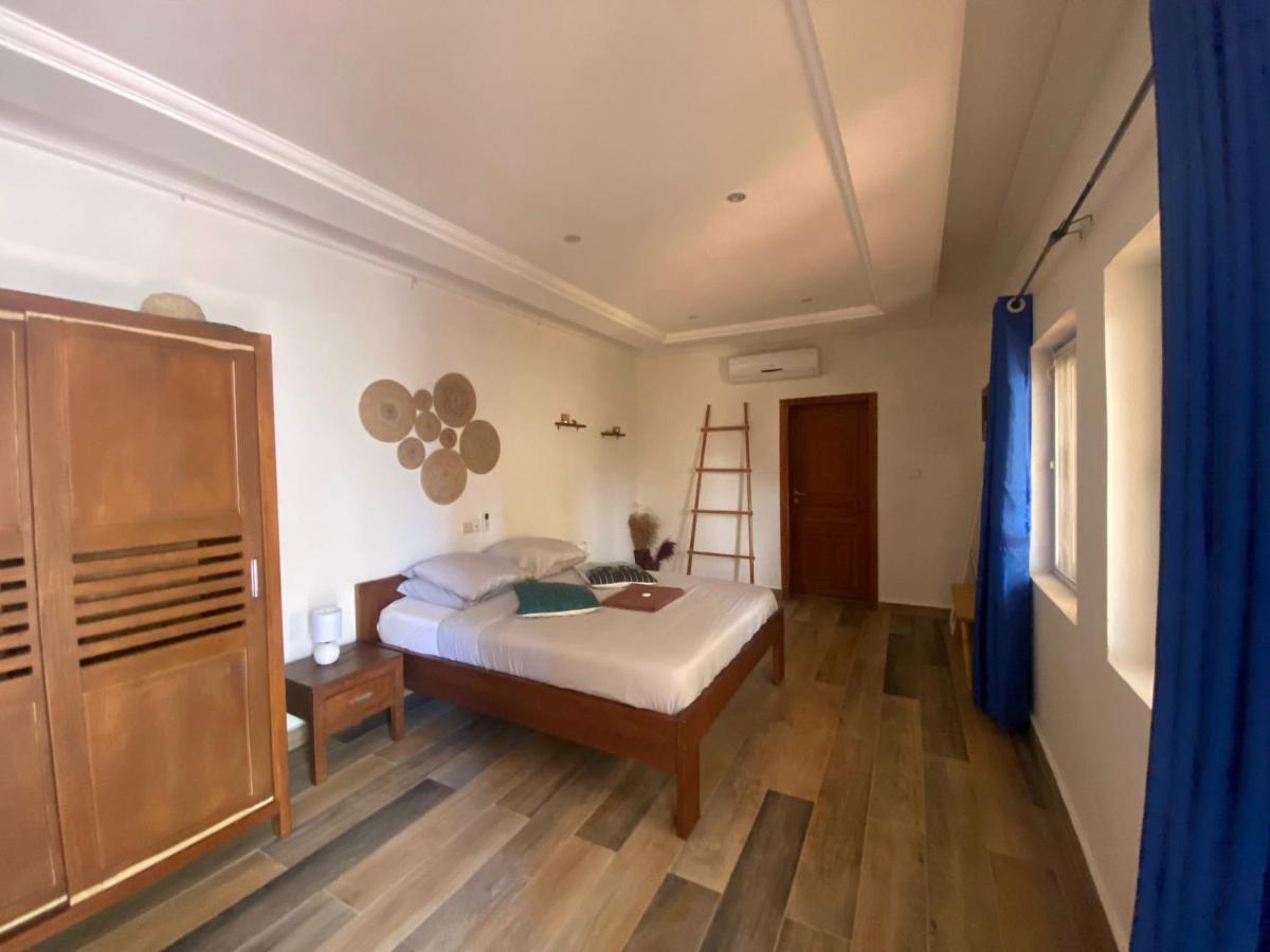 L'Oasis Guesthouse Котону Екстериор снимка