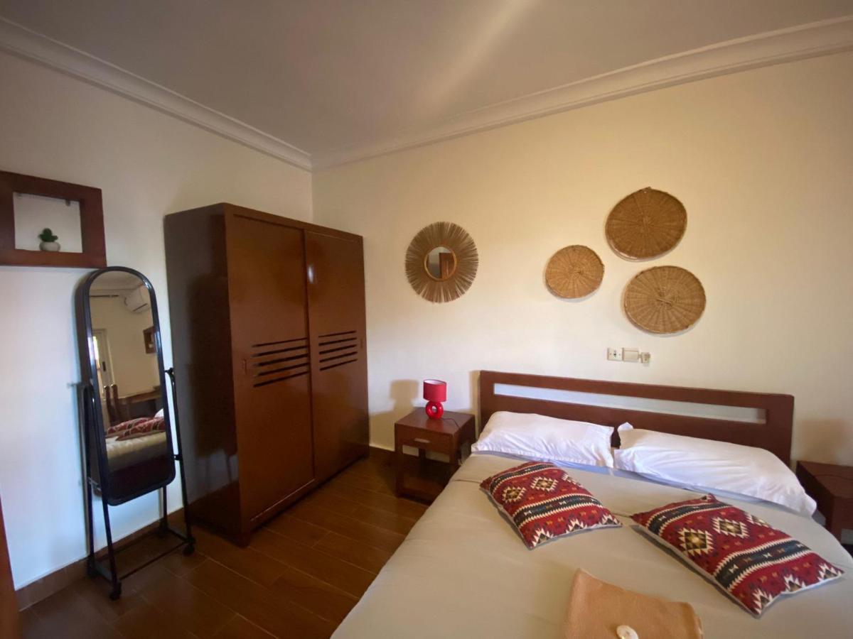 L'Oasis Guesthouse Котону Екстериор снимка