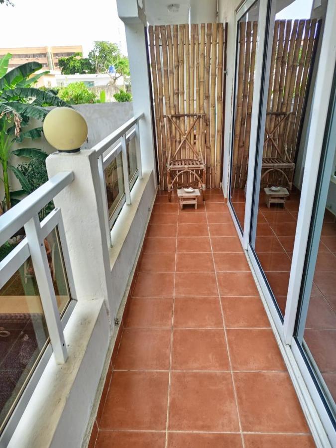 L'Oasis Guesthouse Котону Екстериор снимка