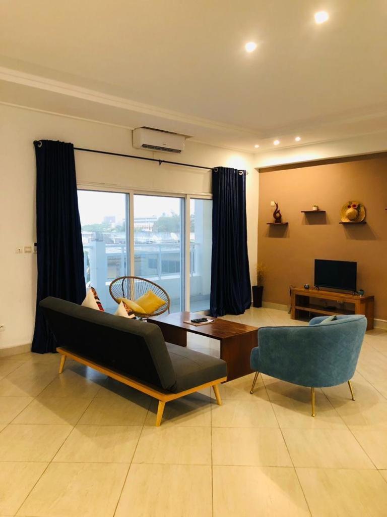 L'Oasis Guesthouse Котону Екстериор снимка