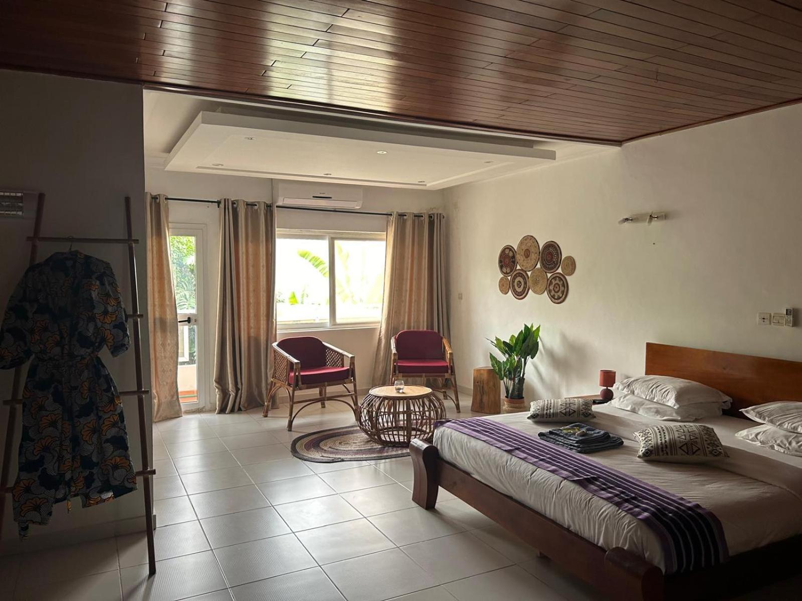 L'Oasis Guesthouse Котону Екстериор снимка